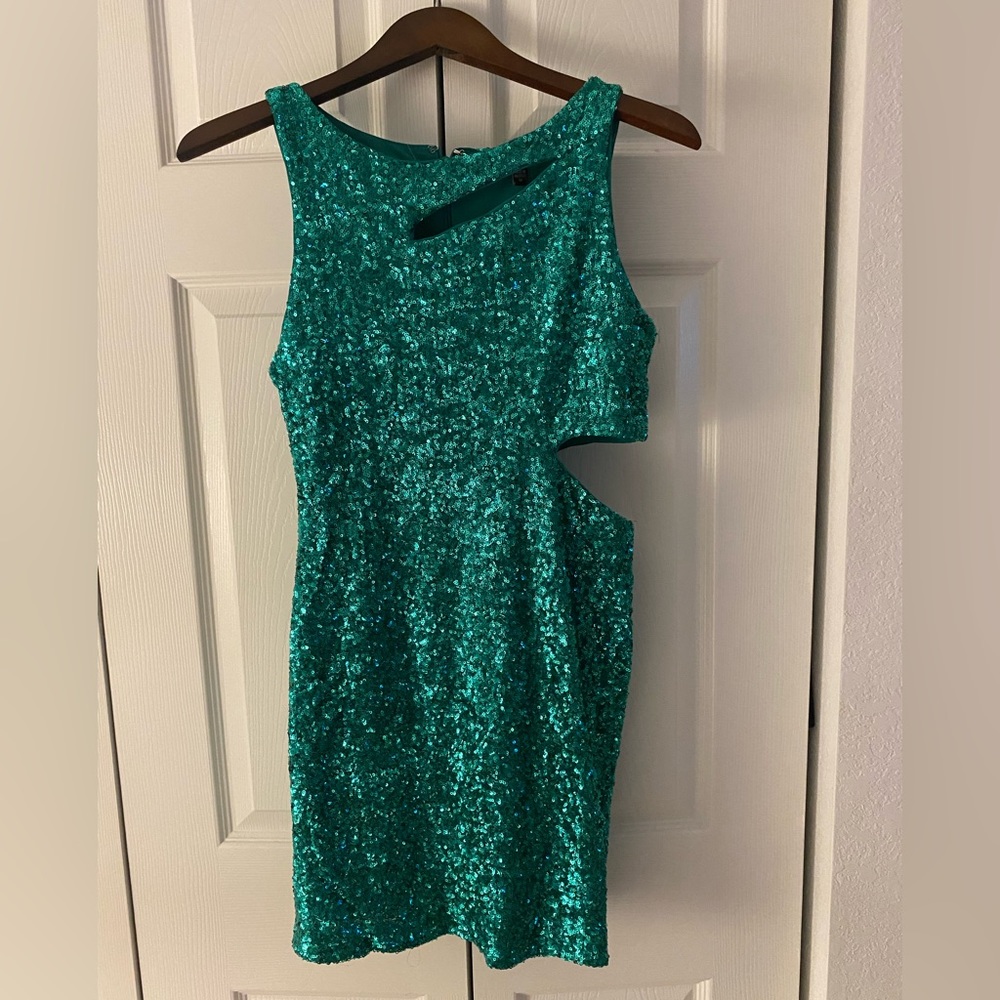 Bebe. Size Medium. Sparkling green. Sequin mini dress.